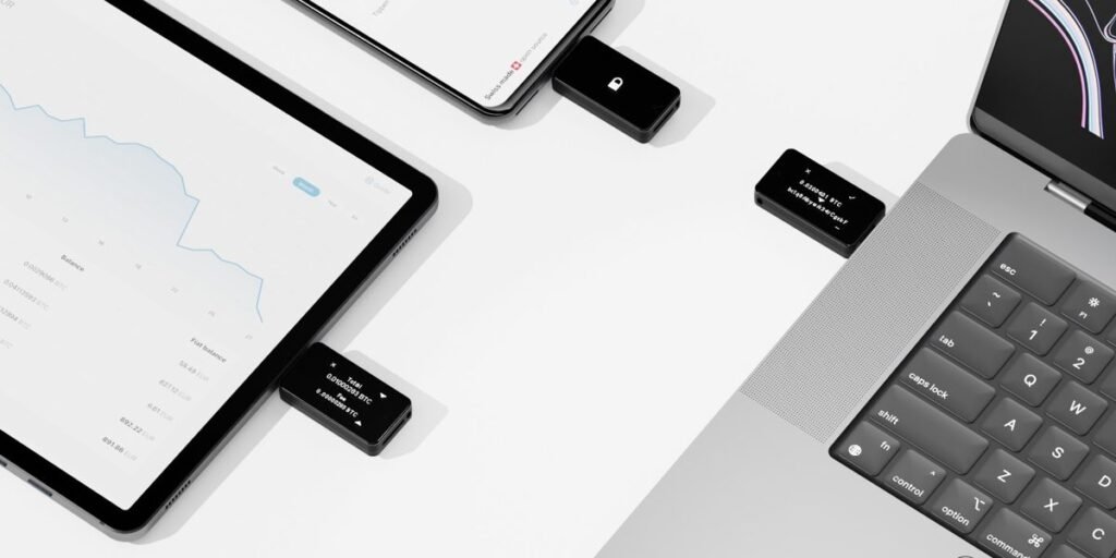 BitBox hardware wallet connected to smartphone, tablet, and laptop for secure cryptocurrency management