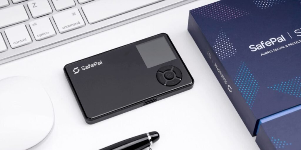 SafePal S1 hardware wallet on a desk next to keyboard and packaging used for secure cryptocurrency cold storage