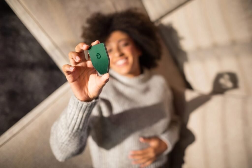 Trezor Safe 5 hardware wallet device held by user for secure cryptocurrency self custody and private key protection