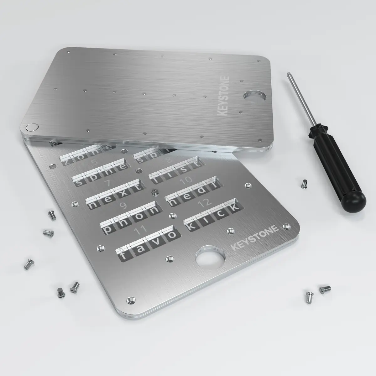 Keystone Tablet Plus setup process Keystone Tablet Plus seed phrase backup device during setup with screwdriver and letter tiles visible